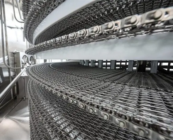 A close-up of the matte, slightly coarse texture of a pickled stainless steel surface.