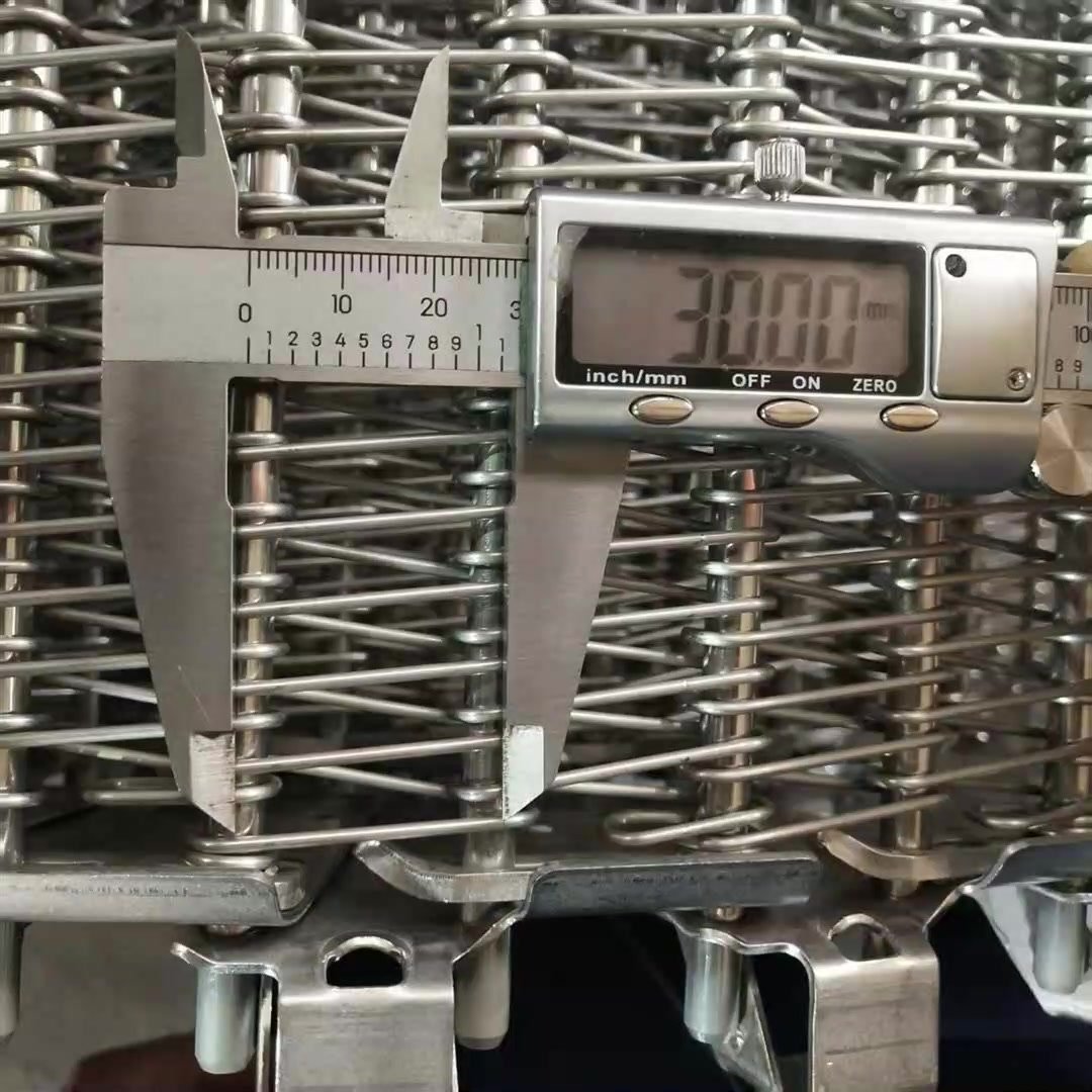 Measuring a self-stacking belt with a digital caliper during inspection