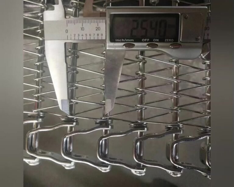 Digital caliper measuring rod pitch on a spiral freezer belt at YIYI Mesh Belt