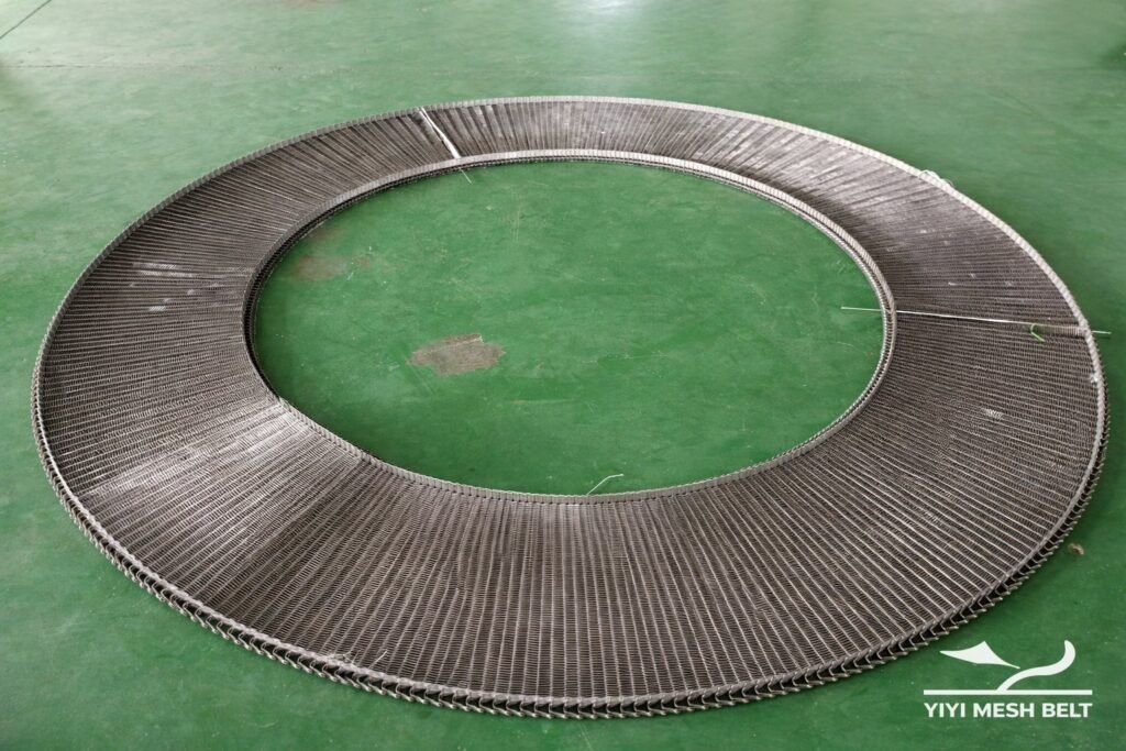Spiral belt section in a turn showing inner edge radius and belt width
